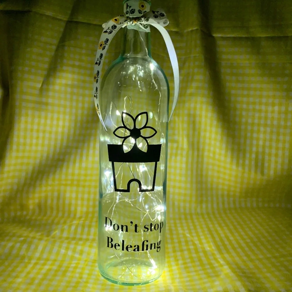 ‘Don’t Stop Beleafing’ logo wine bottle lantern